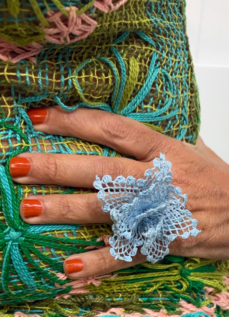 Frangipani, silver ring and simple lace
