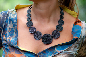 sustainable black necklace with recycled materials and banana fibre